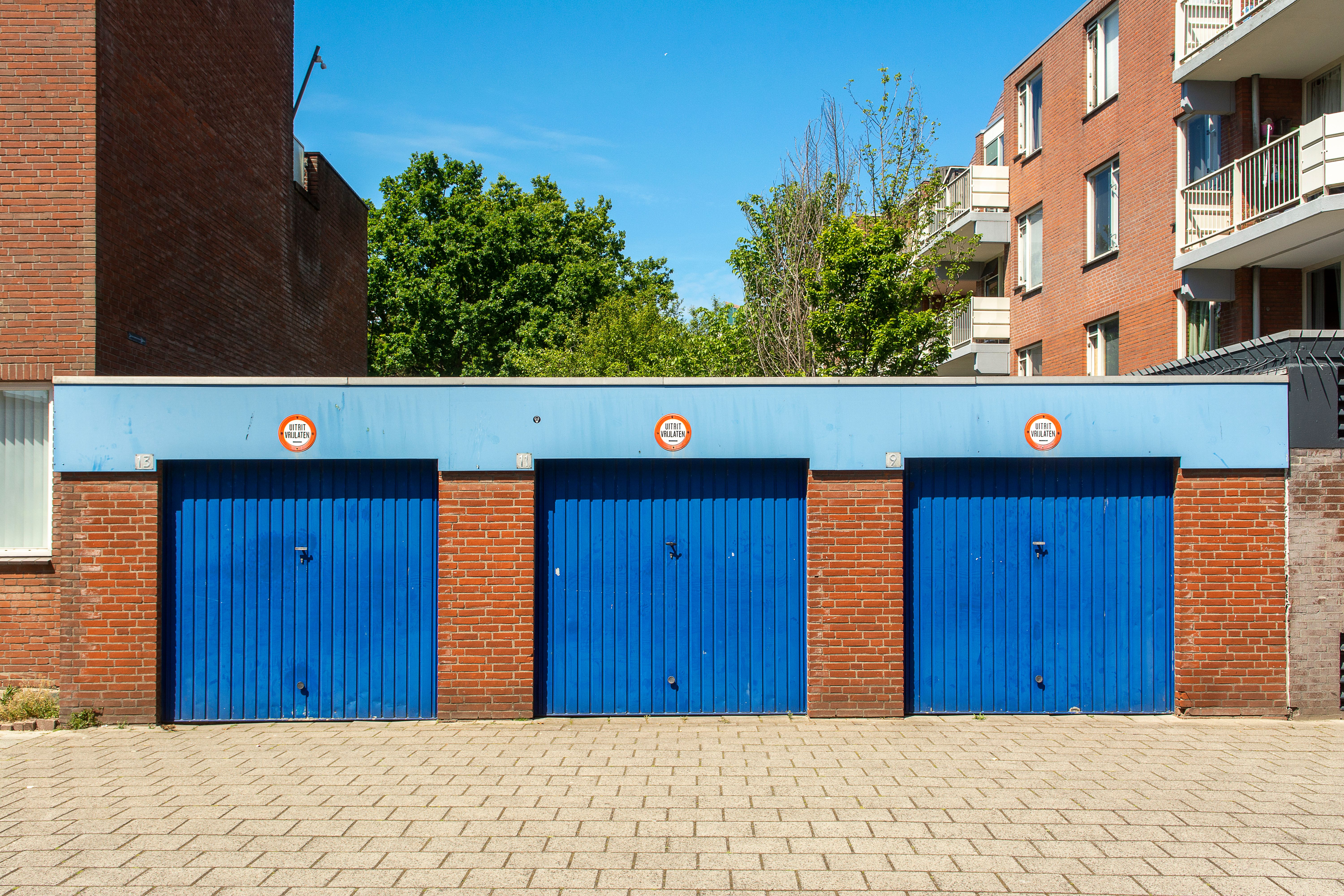 A detailed image of eco-friendly garage storage solutions, using sustainable materials like bamboo or reclaimed wood, with recycling stations and ener