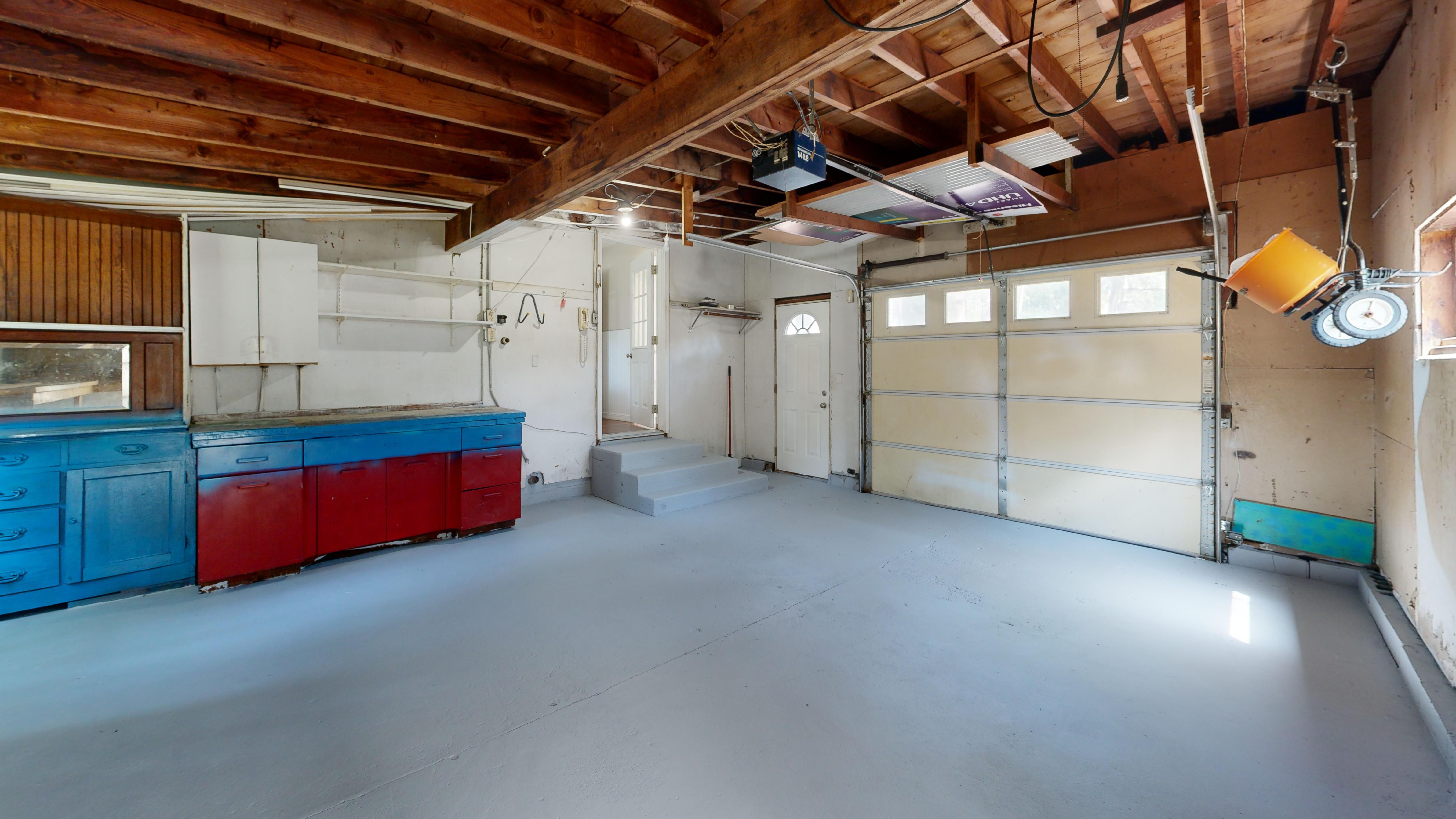 An image depicting the impact of local climate and architecture on garage storage, including moisture-resistant materials and architectural styles typ