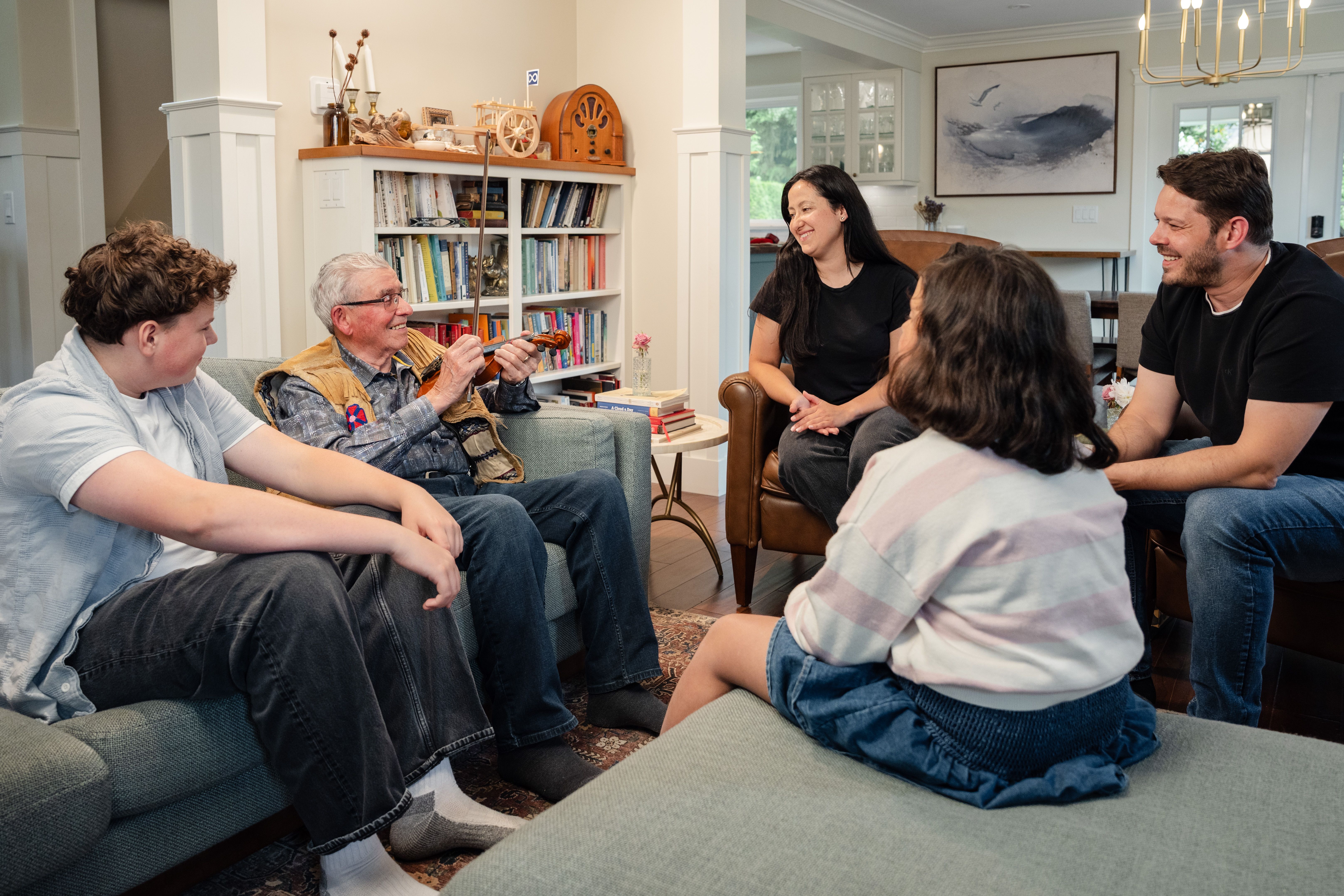 A detailed image of a cozy living room designed for multigenerational families, featuring comfortable seating, a warm color palette, and subtle decor 