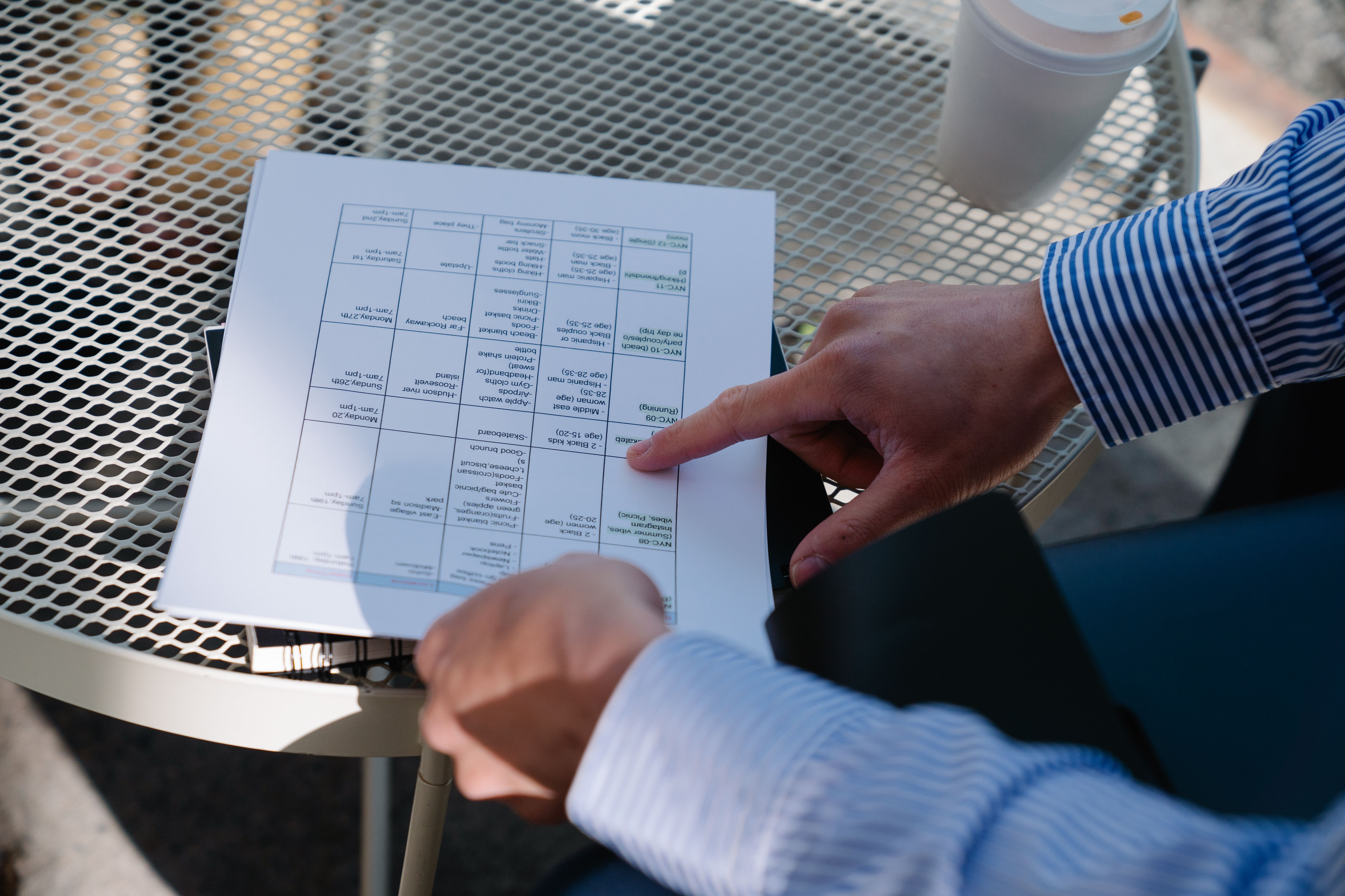A detailed image of a document with the title 'Contractor Warranties and Guarantees' laying on a wooden table, next to a cup of coffee and a pair of r