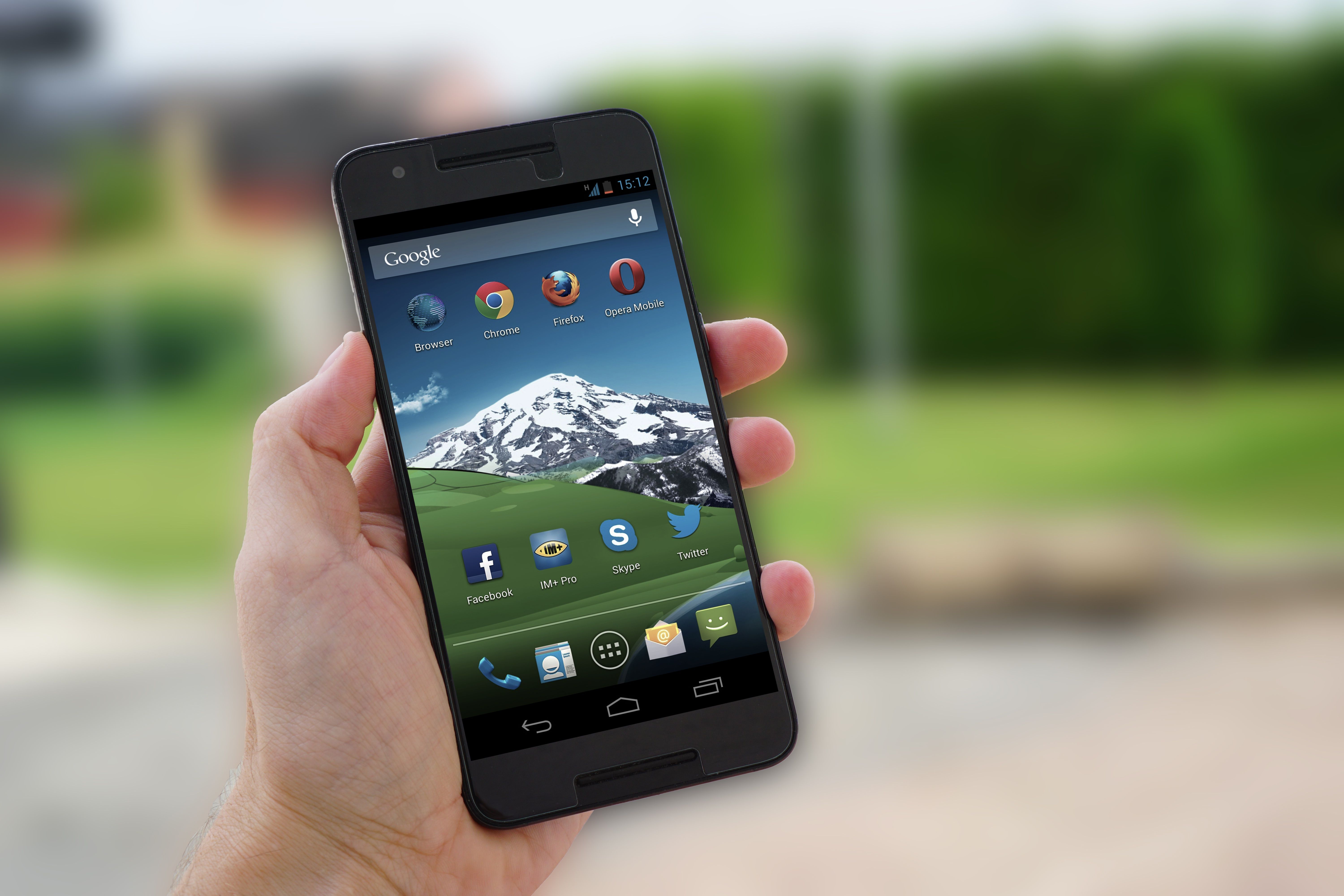 A close-up of a smartphone displaying a smart irrigation app interface, set against a backdrop of a well-maintained garden. The image should emphasize