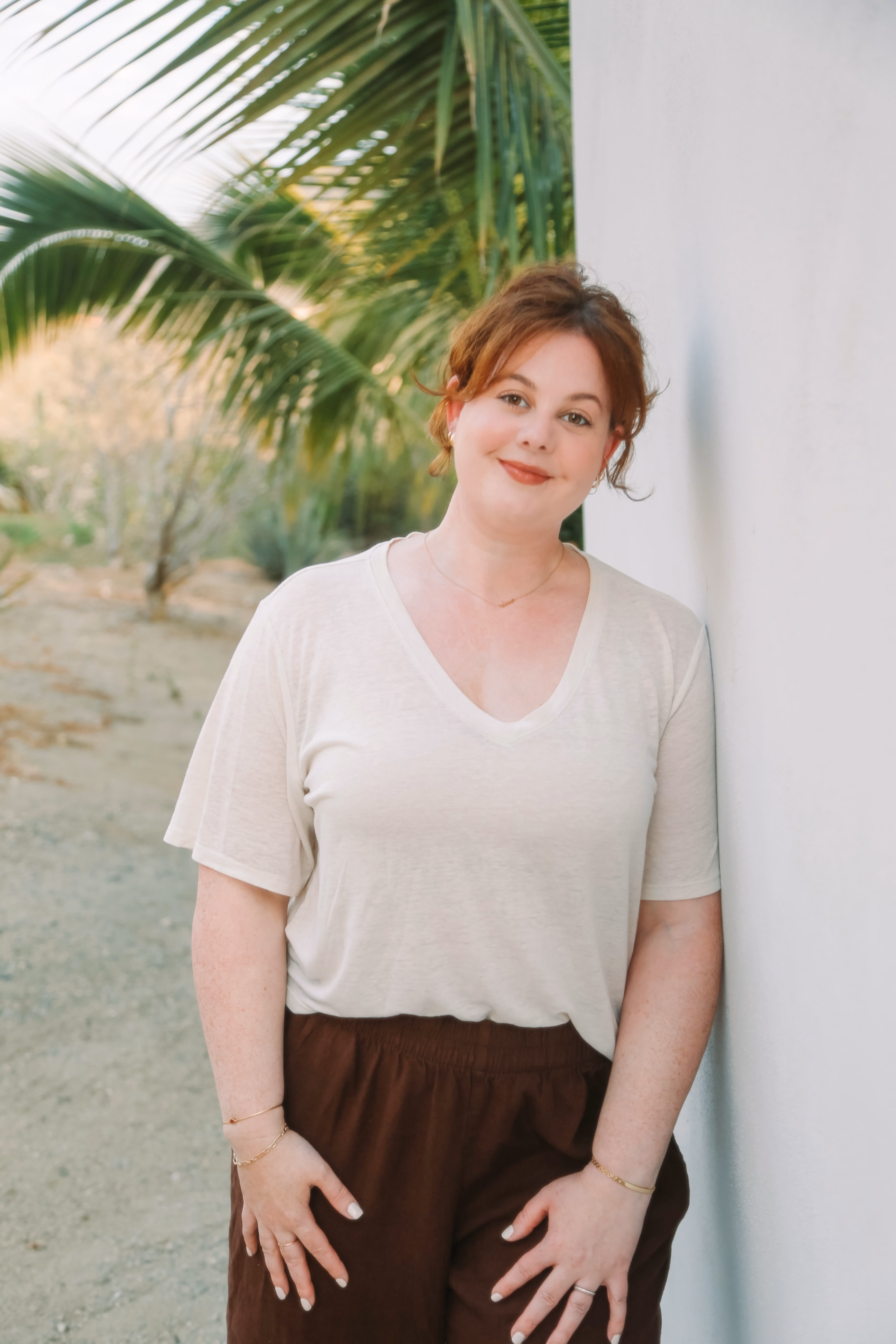 Elise Caldarola on a balcony at sunset