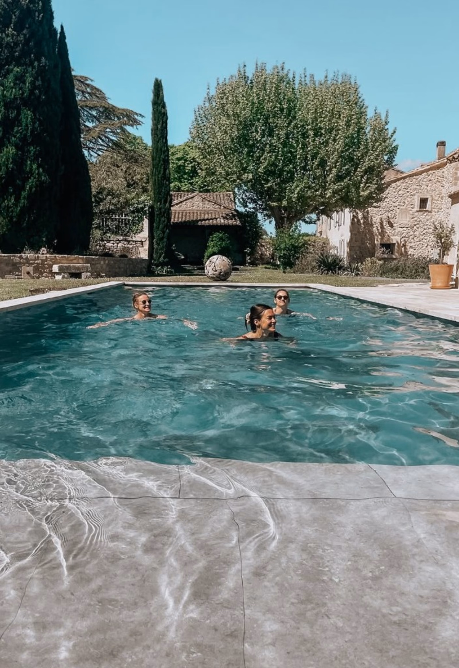 Guests enjoying the pool at Mas Millésime