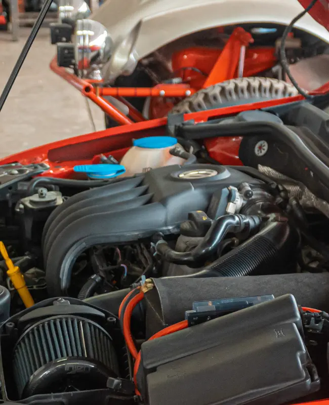 Inspection of exposed engine compartment of an automobile