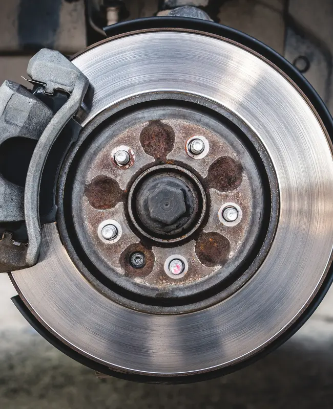 View of automotive brakes attached to a motor vehicle