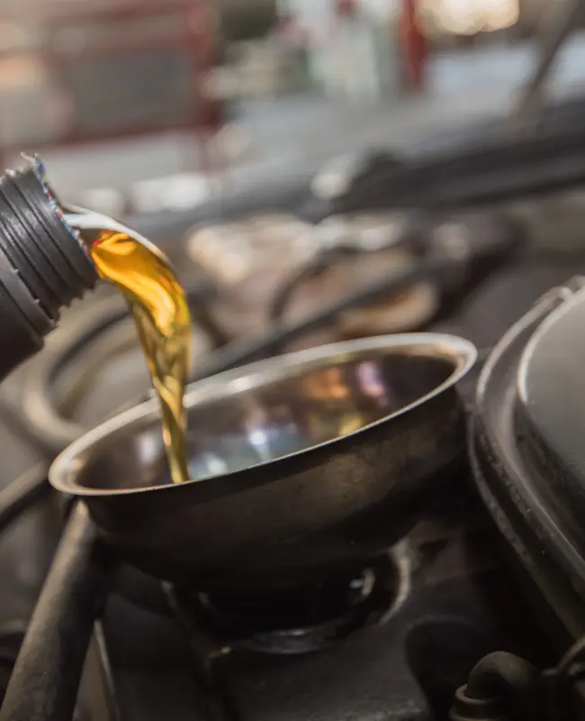 Pouring oil into an automobile engine