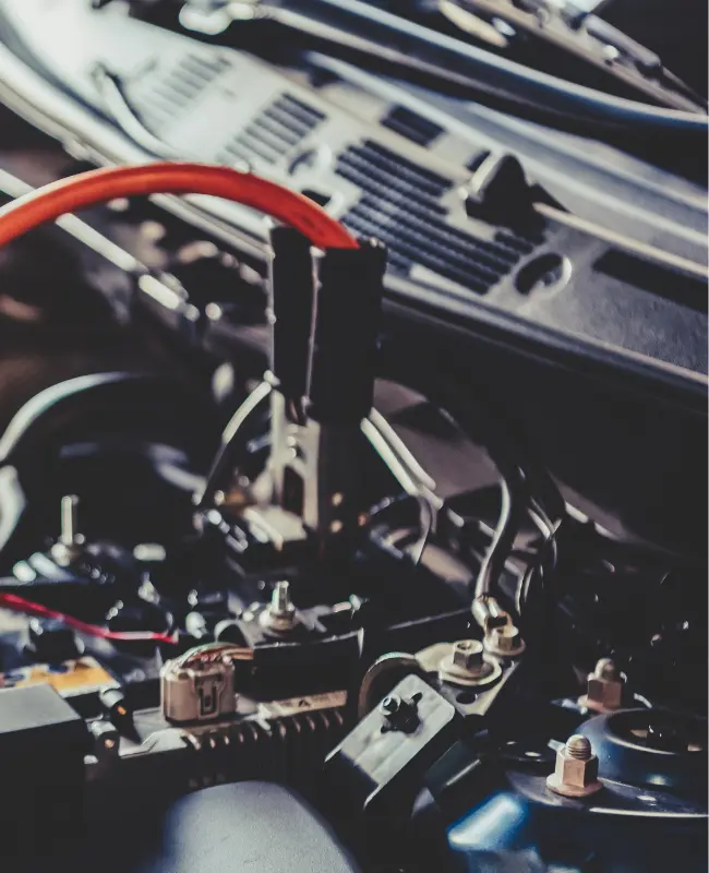 Electrical wires connected to a car battery