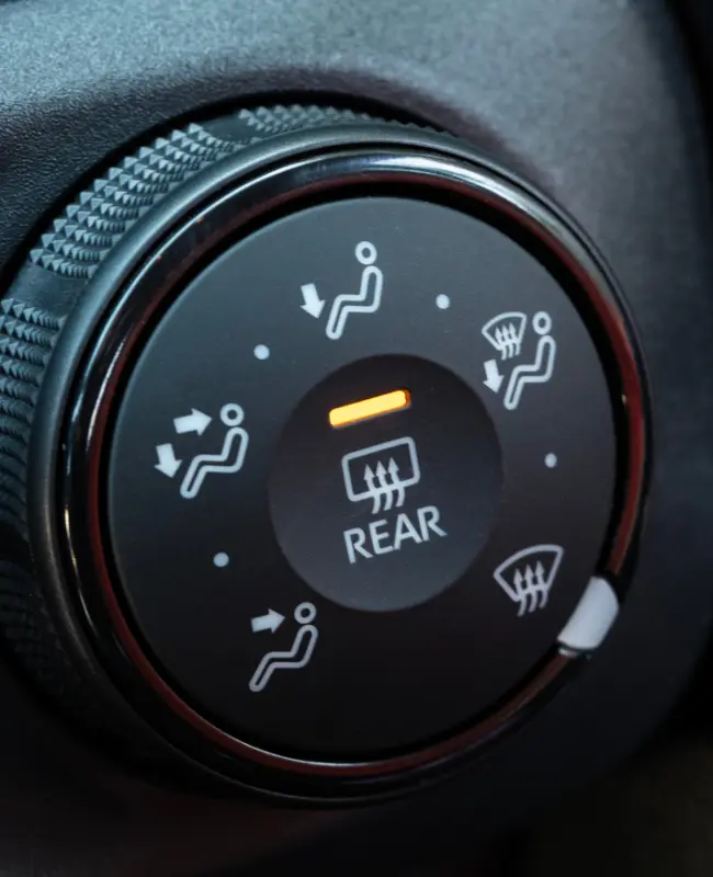 An A/C control knob on a vehicle interior