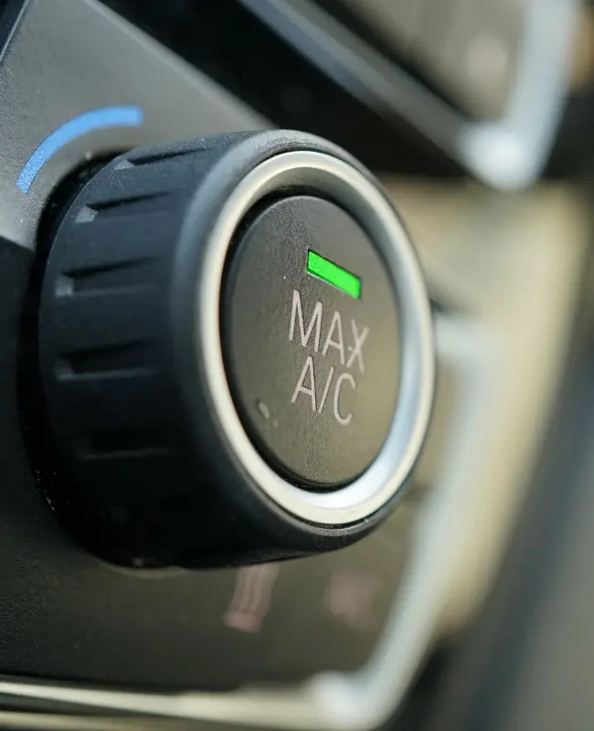 An A/C control knob on a vehicle interior