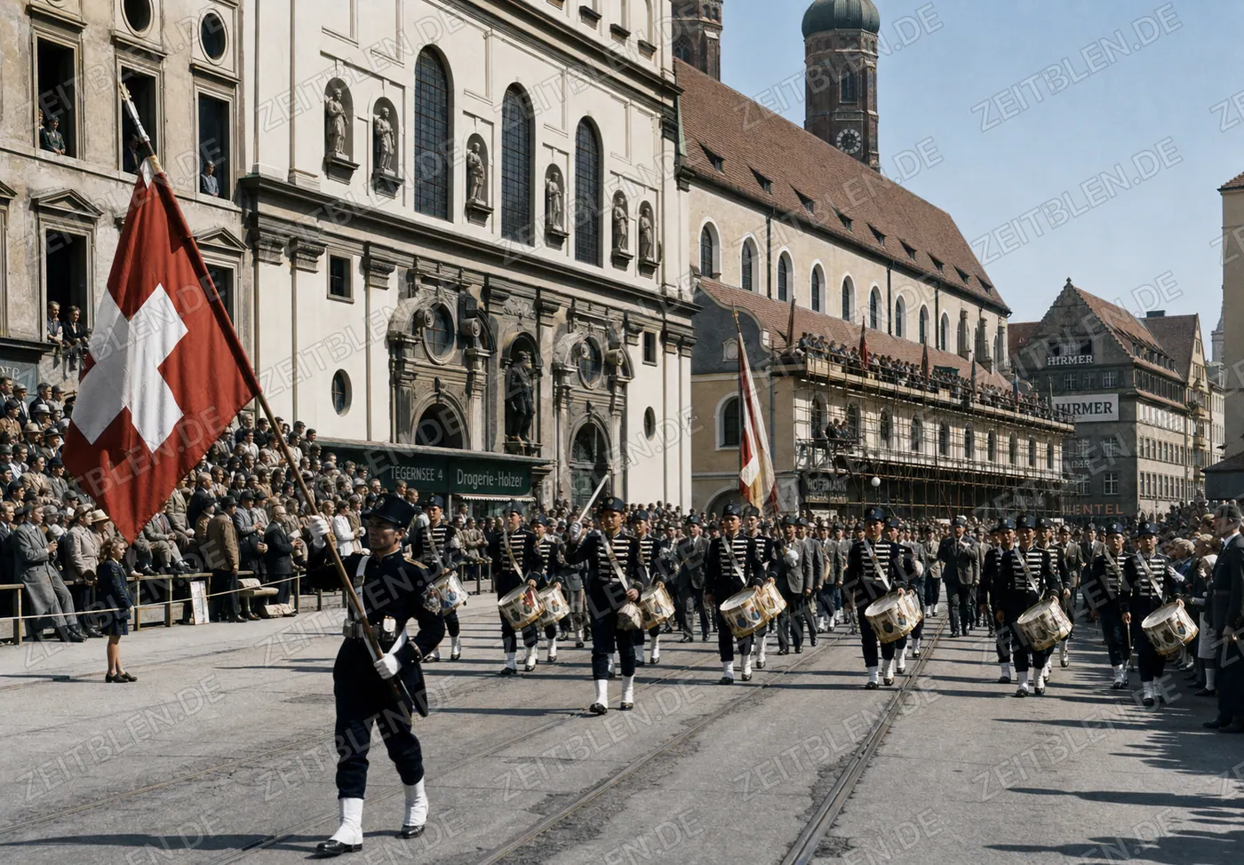 Trommlergruppe mit Schweizer Fahne im Oktoberfestzug vor St. Michael