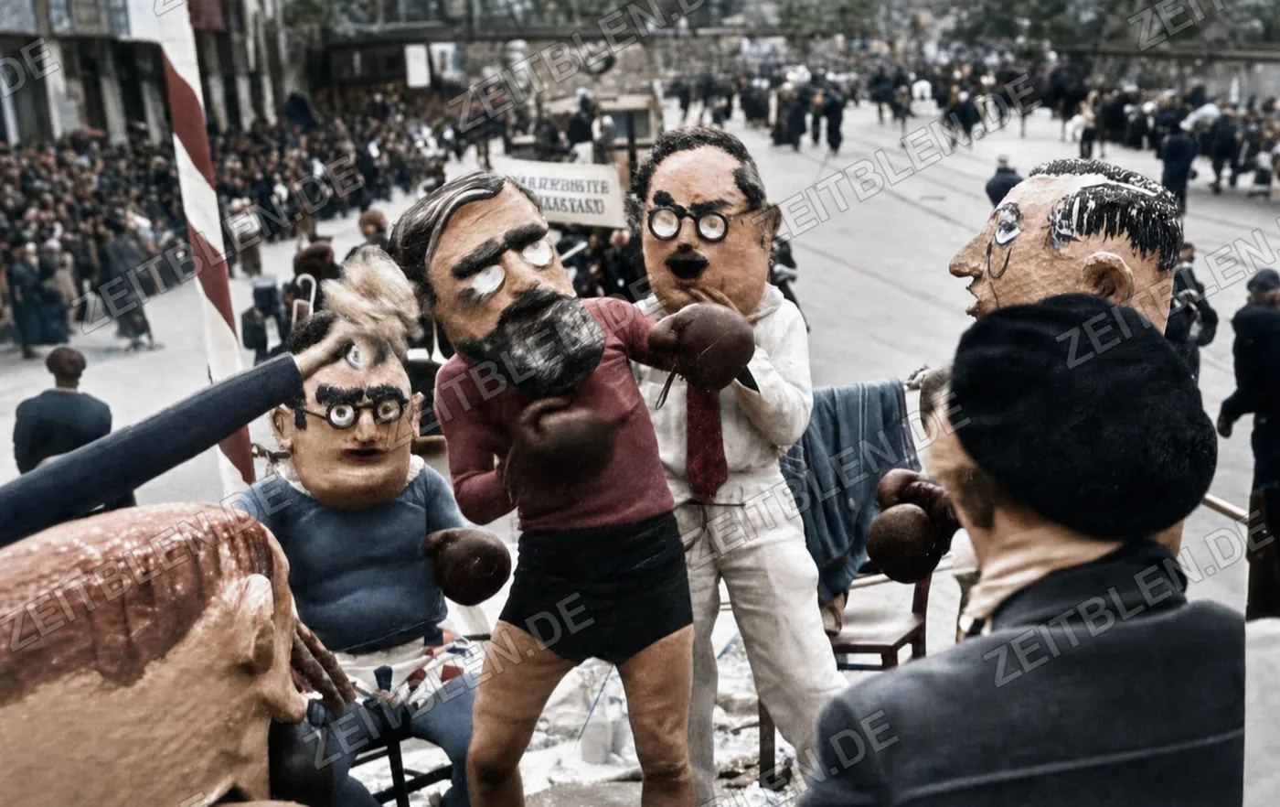 Satirische Karikaturfiguren mit Boxhandschuhen beim Münchner Faschingsumzug, 27. Februar 1