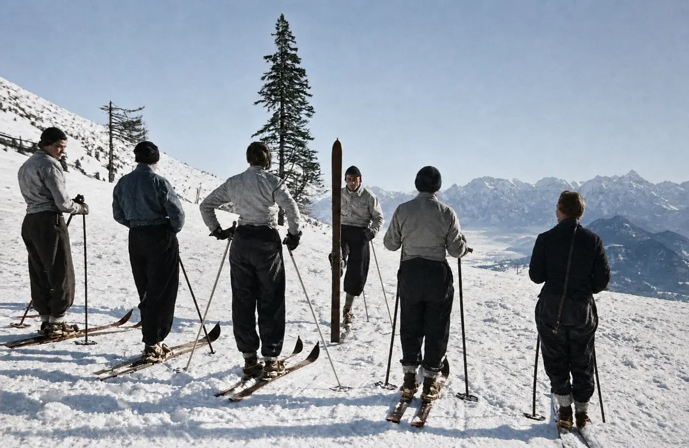 Skilehrer weist eine Gruppe vor der Abfahrt ein