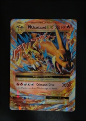 M Charizard EX, graded 8.5