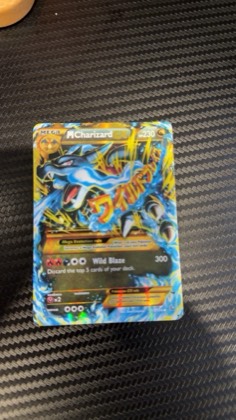 M Charizard EX (X) (Secret) graded 6 & below