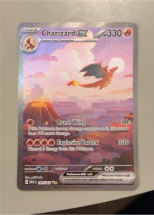Charizard ex, graded 8.5