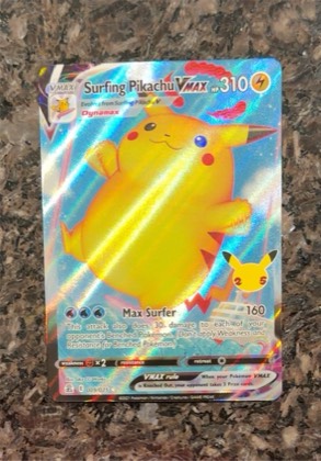 Surfing Pikachu VMAX, graded 9.0