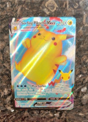 Surfing Pikachu VMAX, graded 4.0