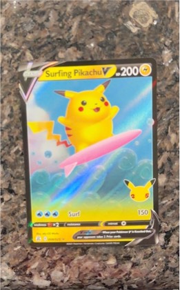 Surfing Pikachu V, graded 8.5