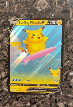 Surfing Pikachu V, graded 8.5