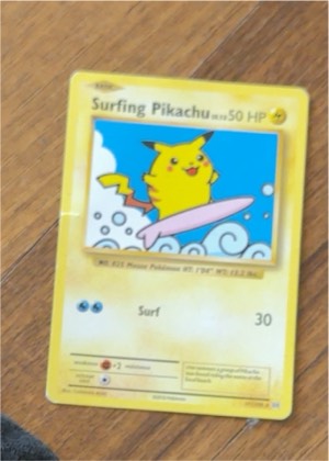Surfing Pikachu, graded 7.0