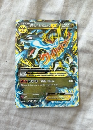 M Charizard EX (X) graded 6 & below