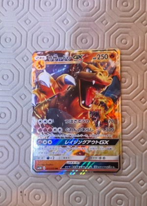Charizard GX, graded 8.5
