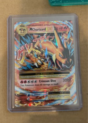 M Charizard-EX, graded 8.0