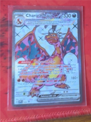 Charizard ex, graded 8.5