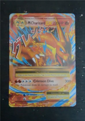 M Charizard EX (Y), graded 7.0