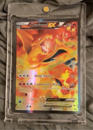 Charizard EX, graded 7.0