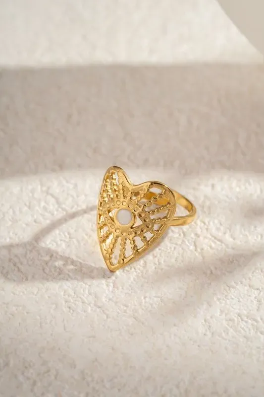 Bague coeur oeil doré pierre blanche symbolique élégant
