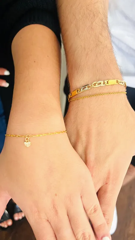 Close-up of a men's permanent bracelet, showcasing its sleek design and comfortable fit on a wrist