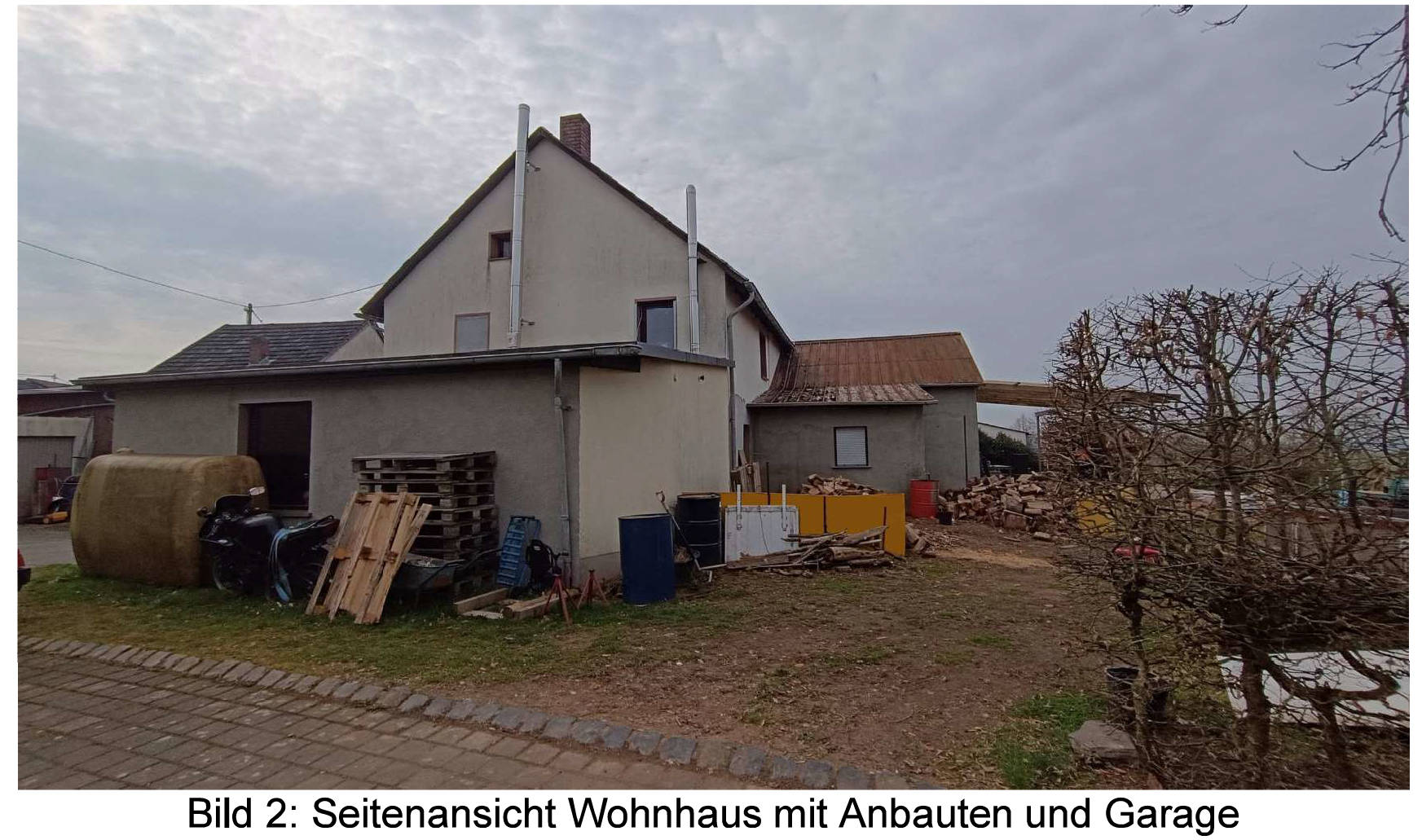 Ein mit Wohnhaus und Nebengebäuden bebautes Grundstück in Hauptstraße 59, 54518 Minderlittgen - Bild 2