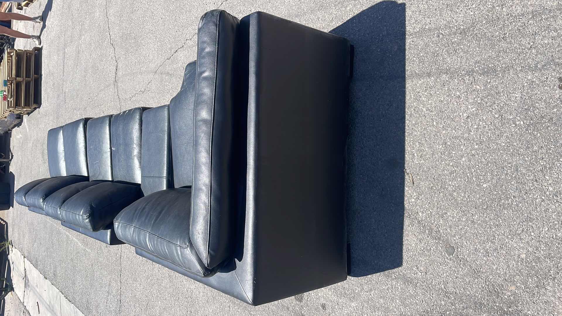 Photo 9 of BLACK LEATHER MULTI SECTION COUCH 165” x45”