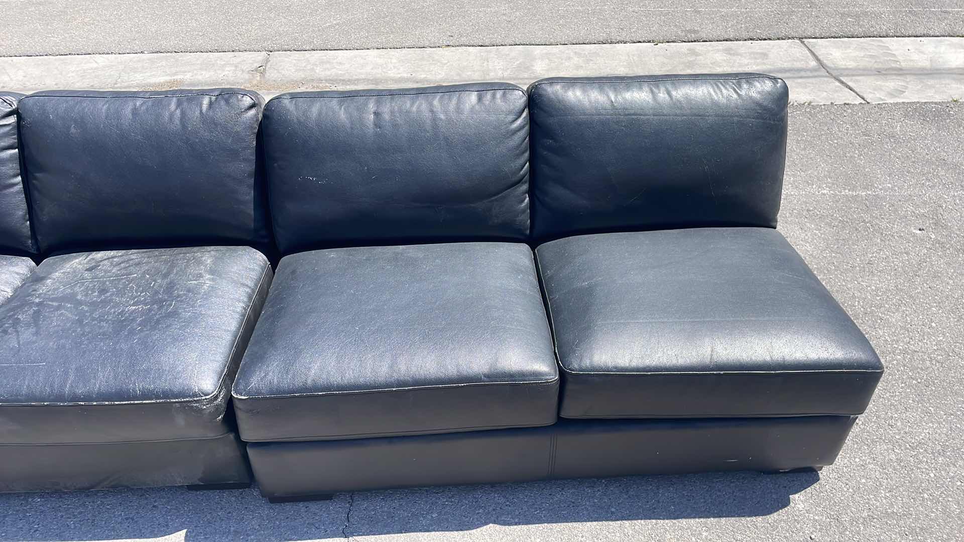 Photo 5 of BLACK LEATHER MULTI SECTION COUCH 165” x45”