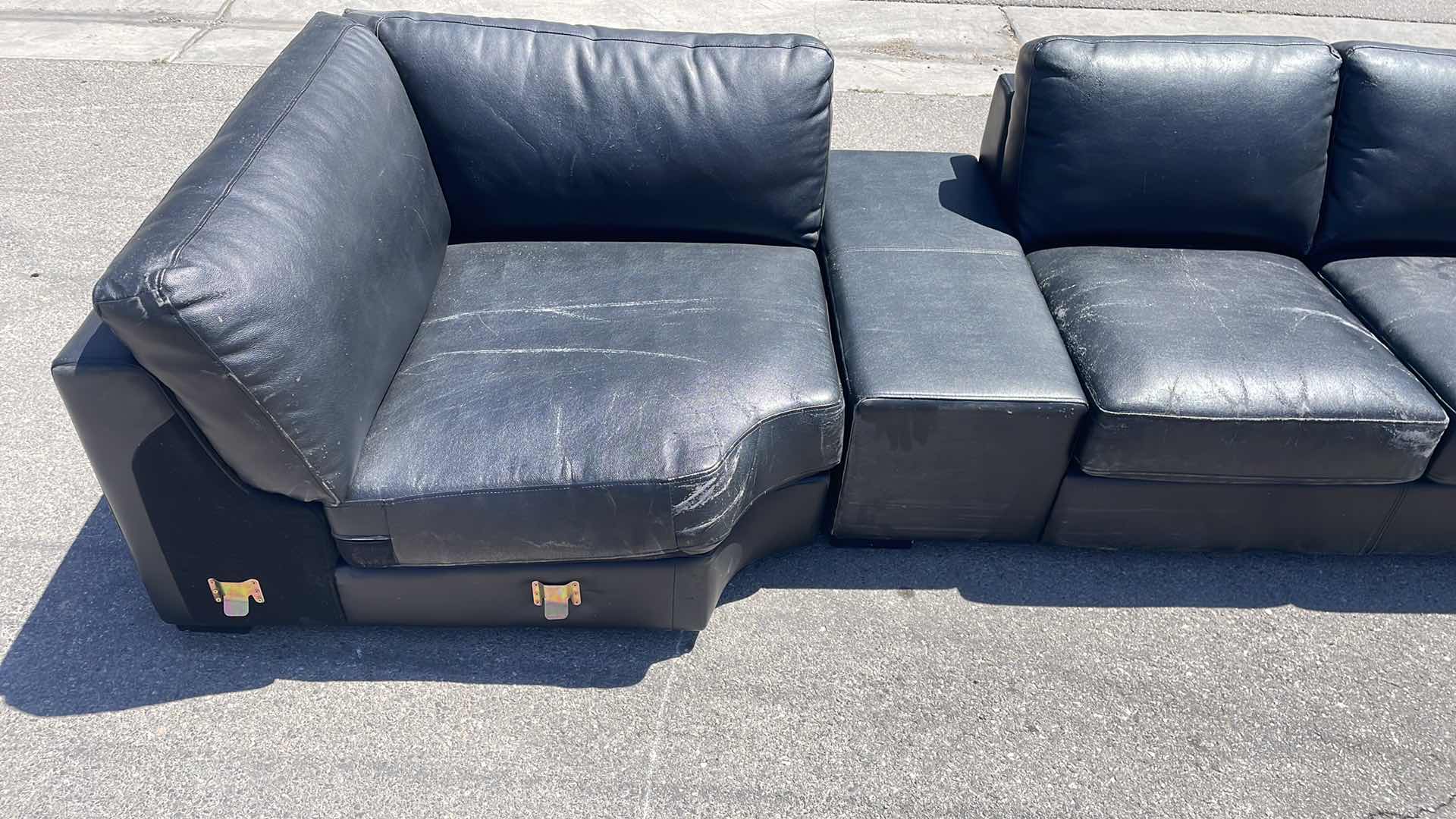 Photo 2 of BLACK LEATHER MULTI SECTION COUCH 165” x45”