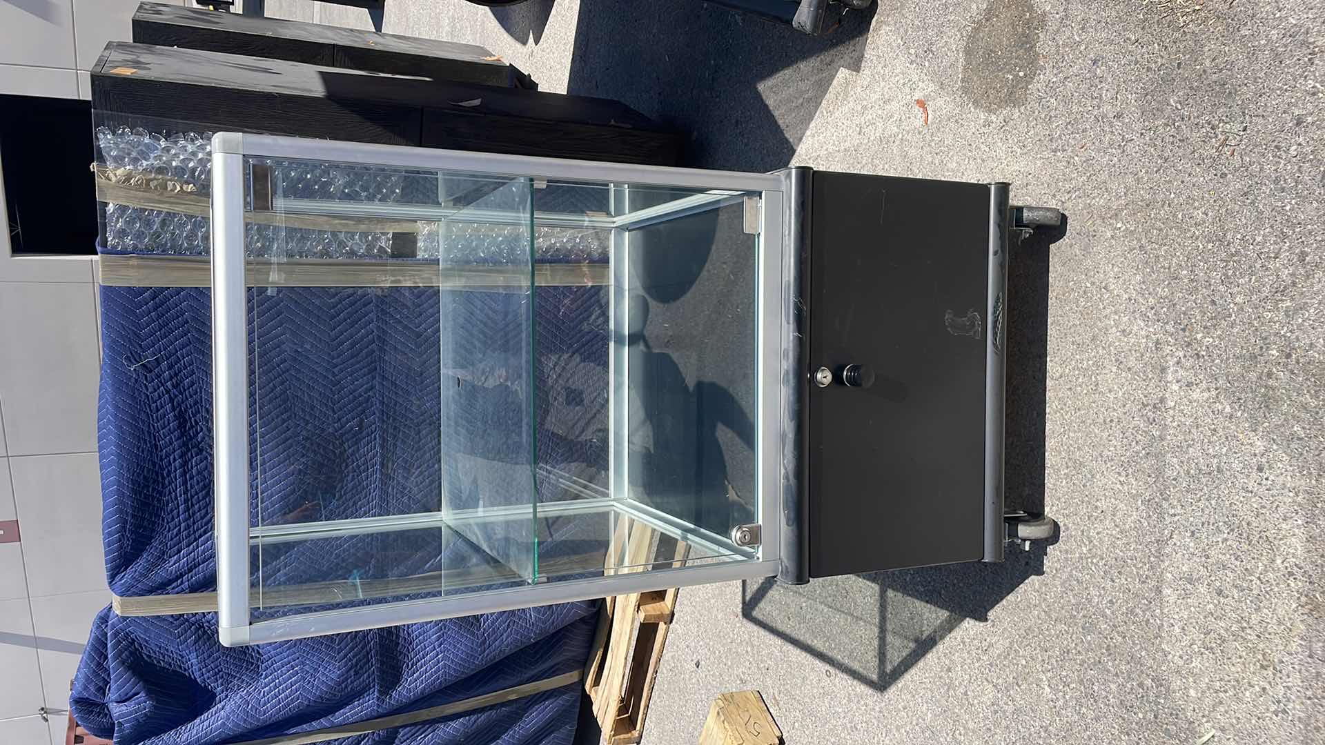 Photo 1 of GLASS DISPLAY CASE ON WHEELS 23” x 23” x 48” LOCKED AND NO KEYS