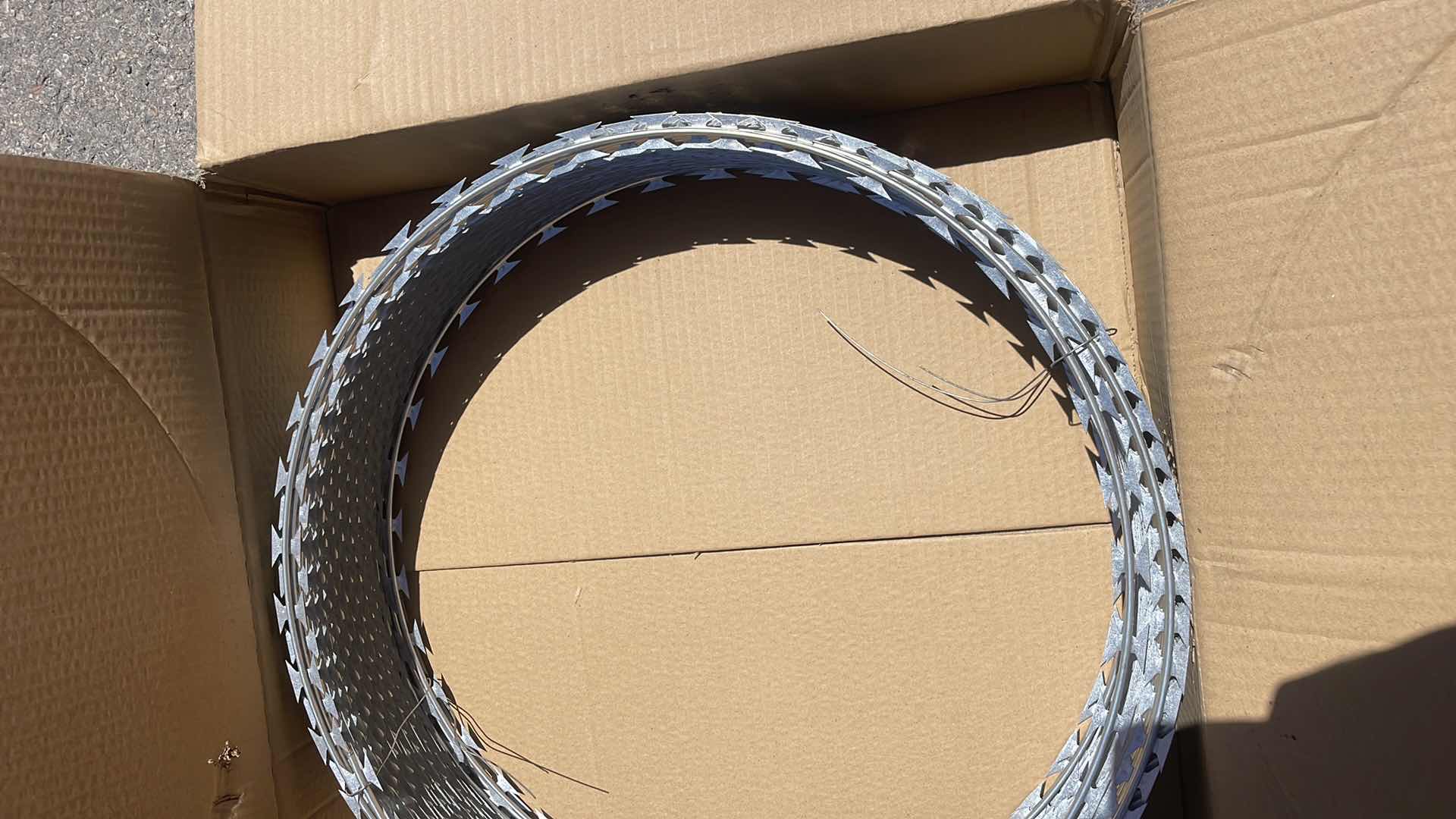 Photo 1 of NEW COIL OF RAZOR WIRE UNKNOWN FOOTAGE