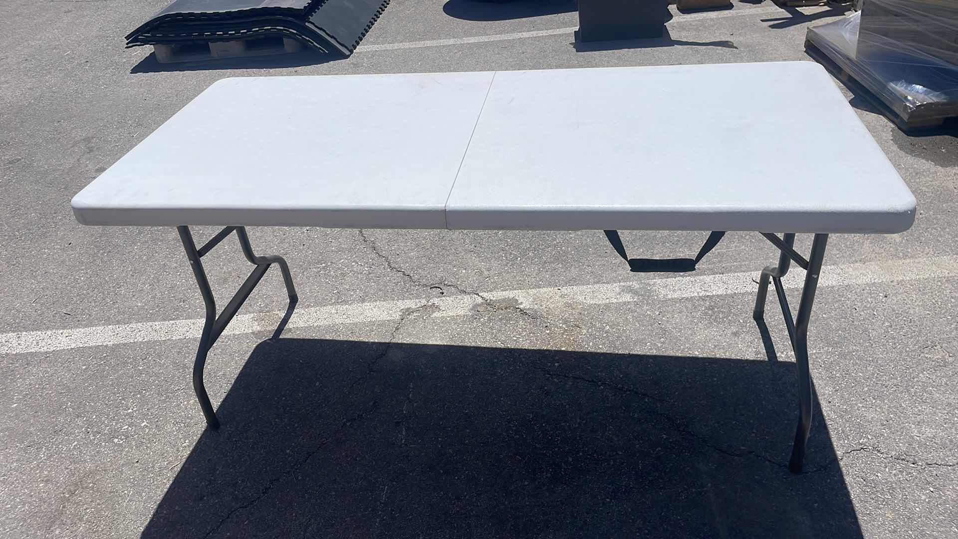 Photo 2 of COSCO FOLDING TABLE 63” x 28”