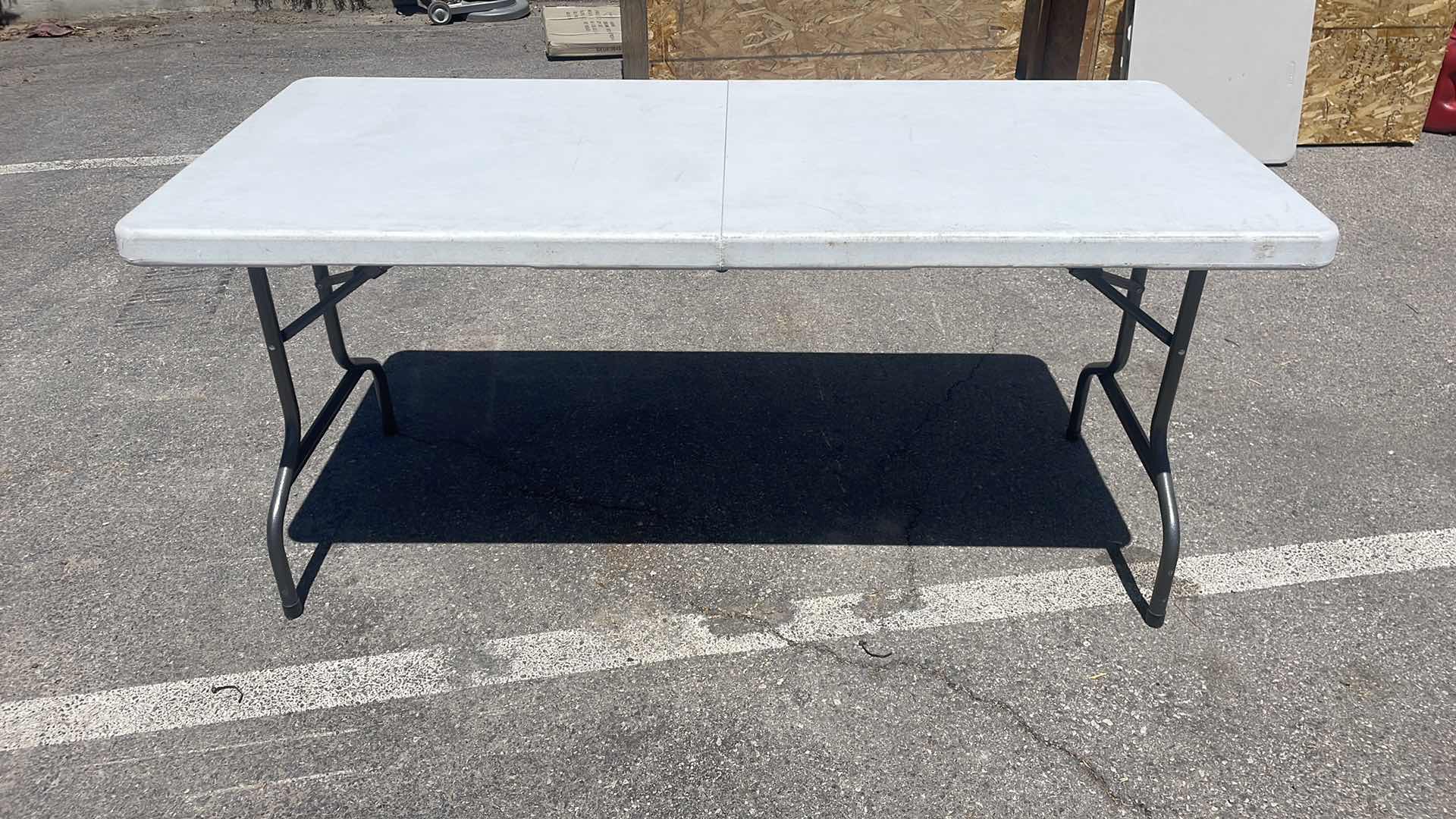 Photo 1 of COSCO FOLDING TABLE 63” x 28”