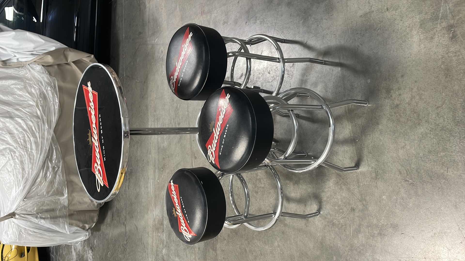 Photo 1 of BUDWEISER BAR TABLE 27” AND 3 BAR STOOLS