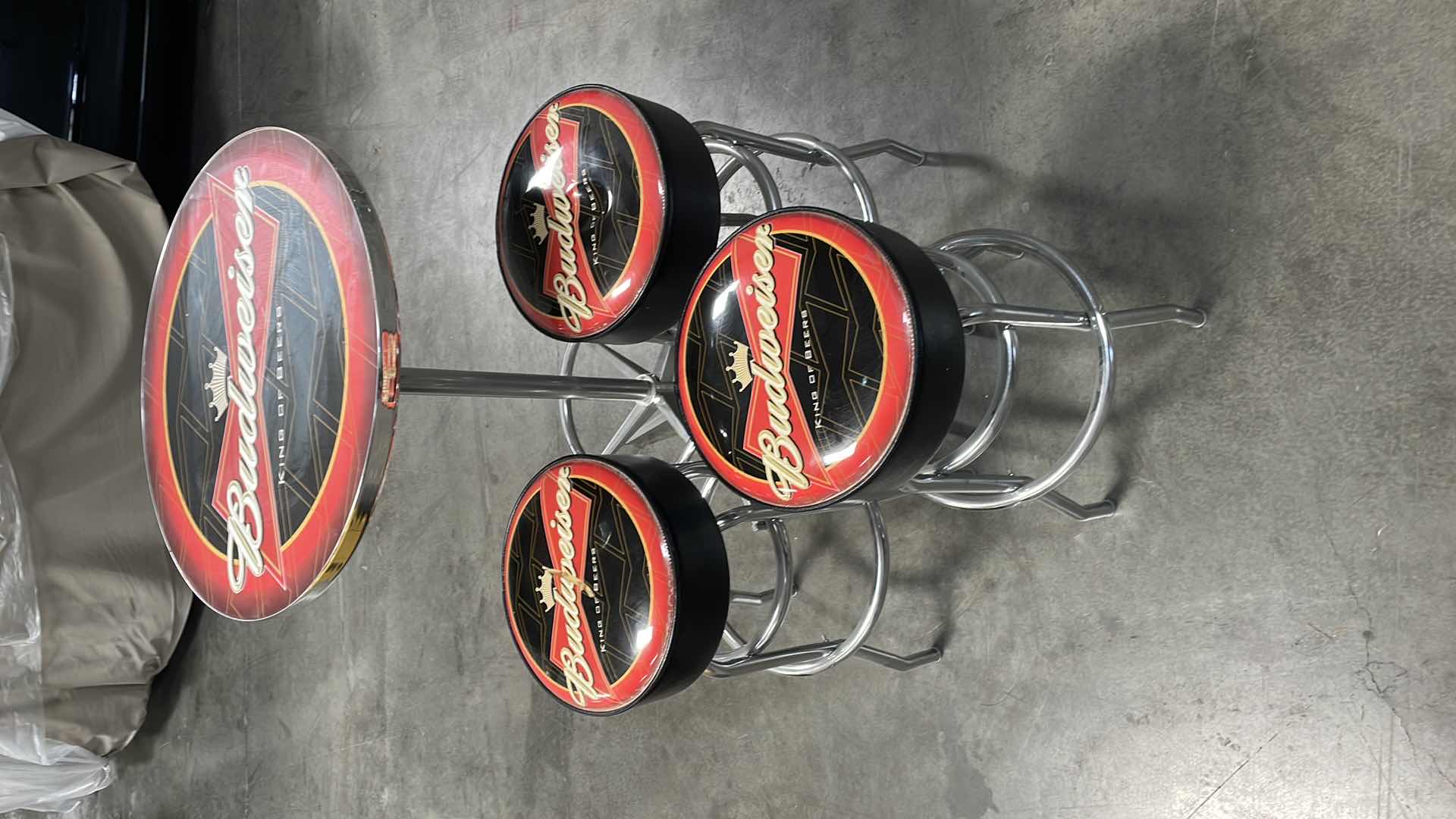 Photo 1 of BUDWEISER BAR TABLE 27” AND 3 BAR STOOLS