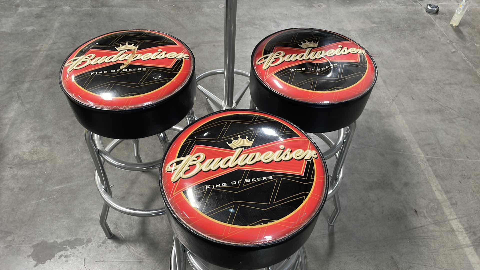 Photo 2 of BUDWEISER BAR TABLE 27” AND 3 BAR STOOLS