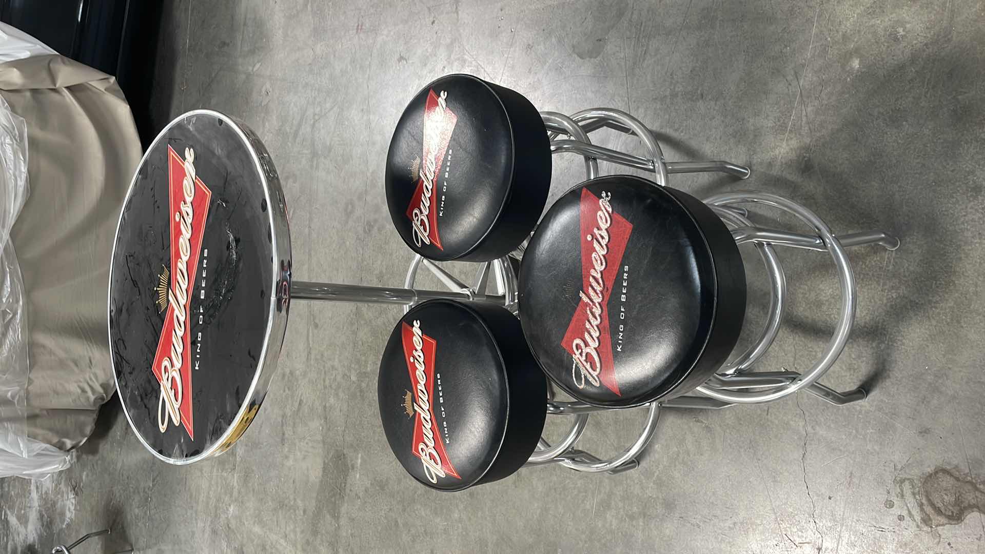 Photo 1 of BUDWEISER BAR TABLE 27” AND 3 BAR STOOLS