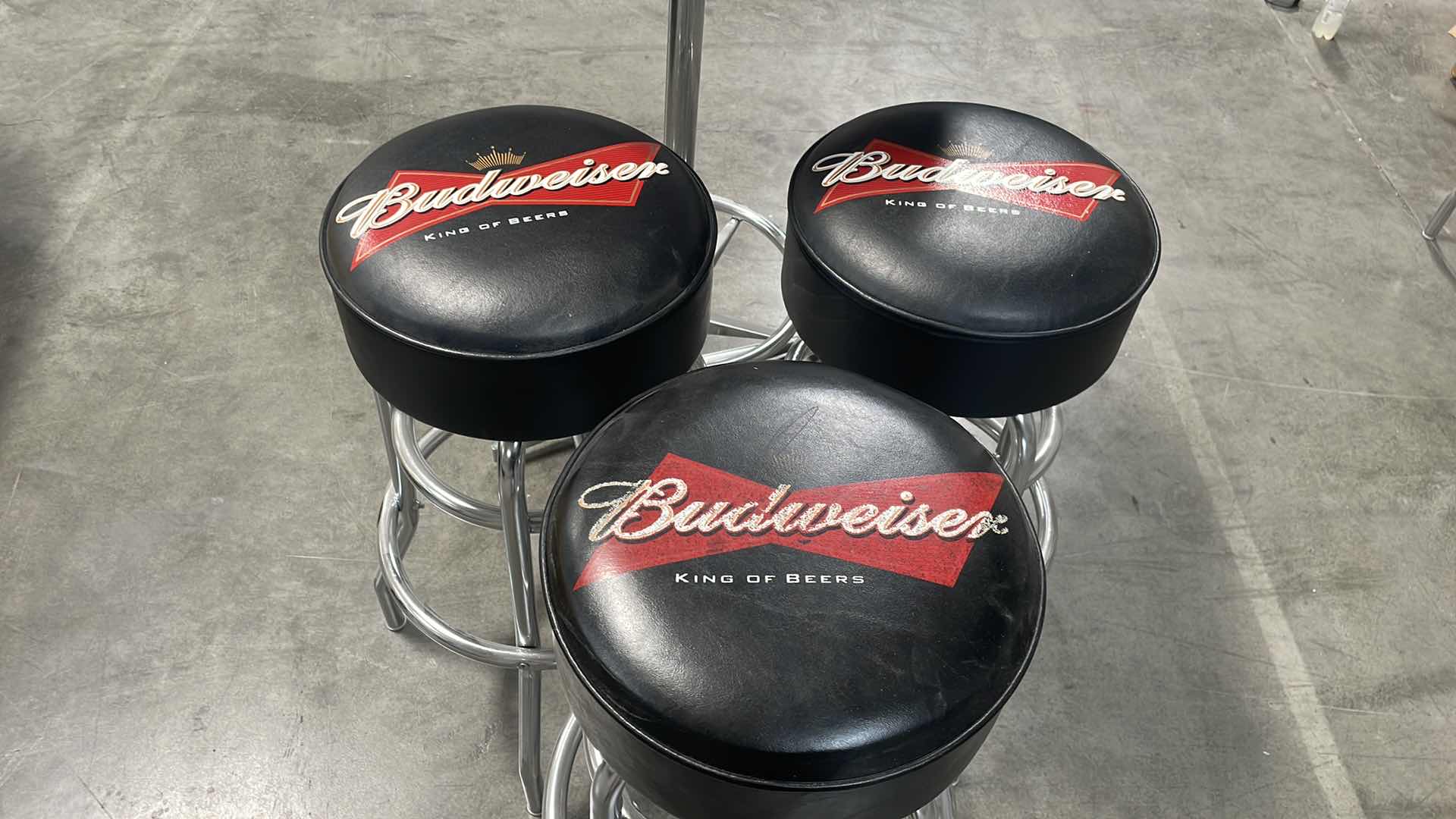 Photo 2 of BUDWEISER BAR TABLE 27” AND 3 BAR STOOLS