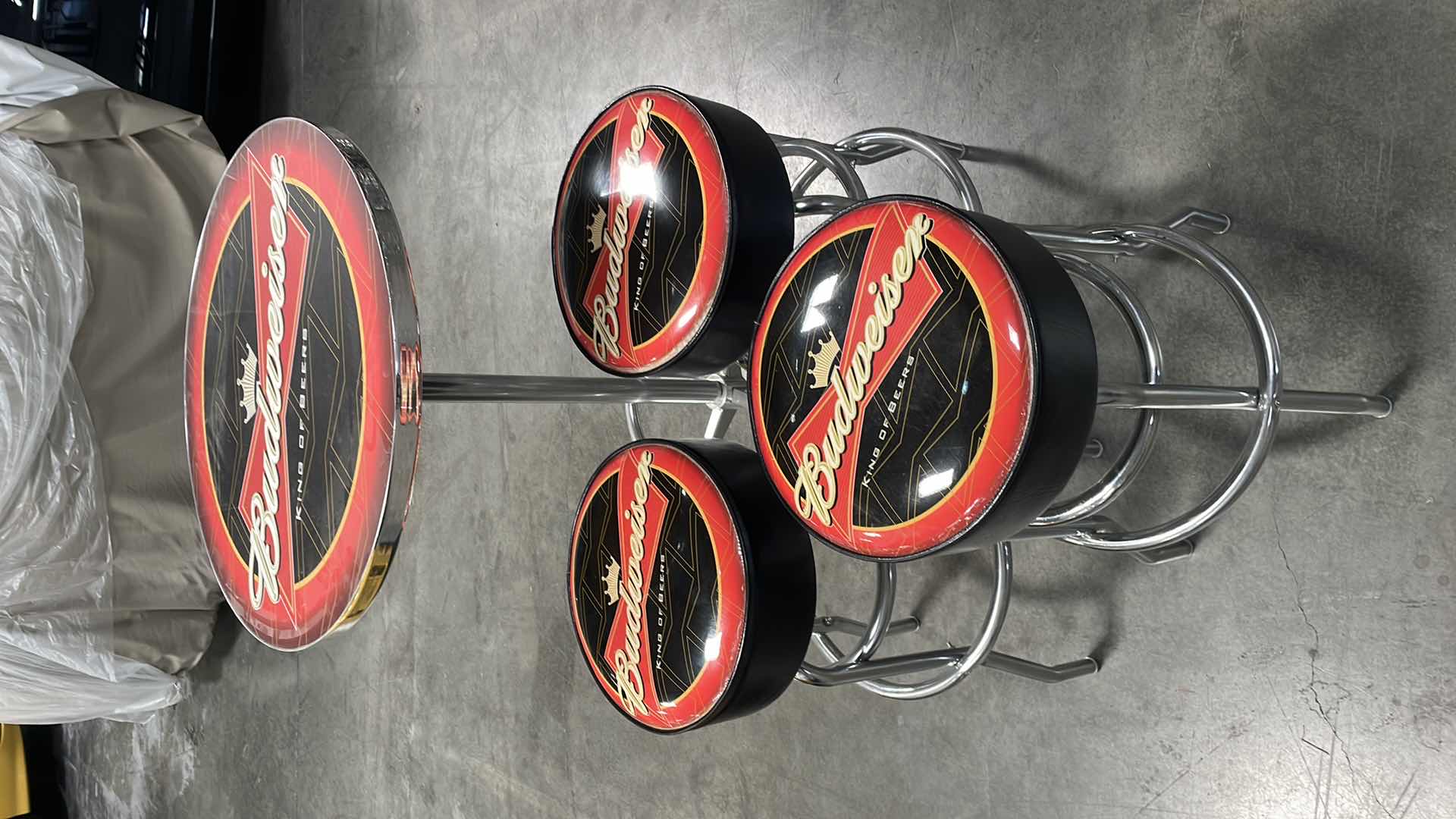 Photo 1 of BUDWEISER BAR TABLE 27” AND 3 BAR STOOLS