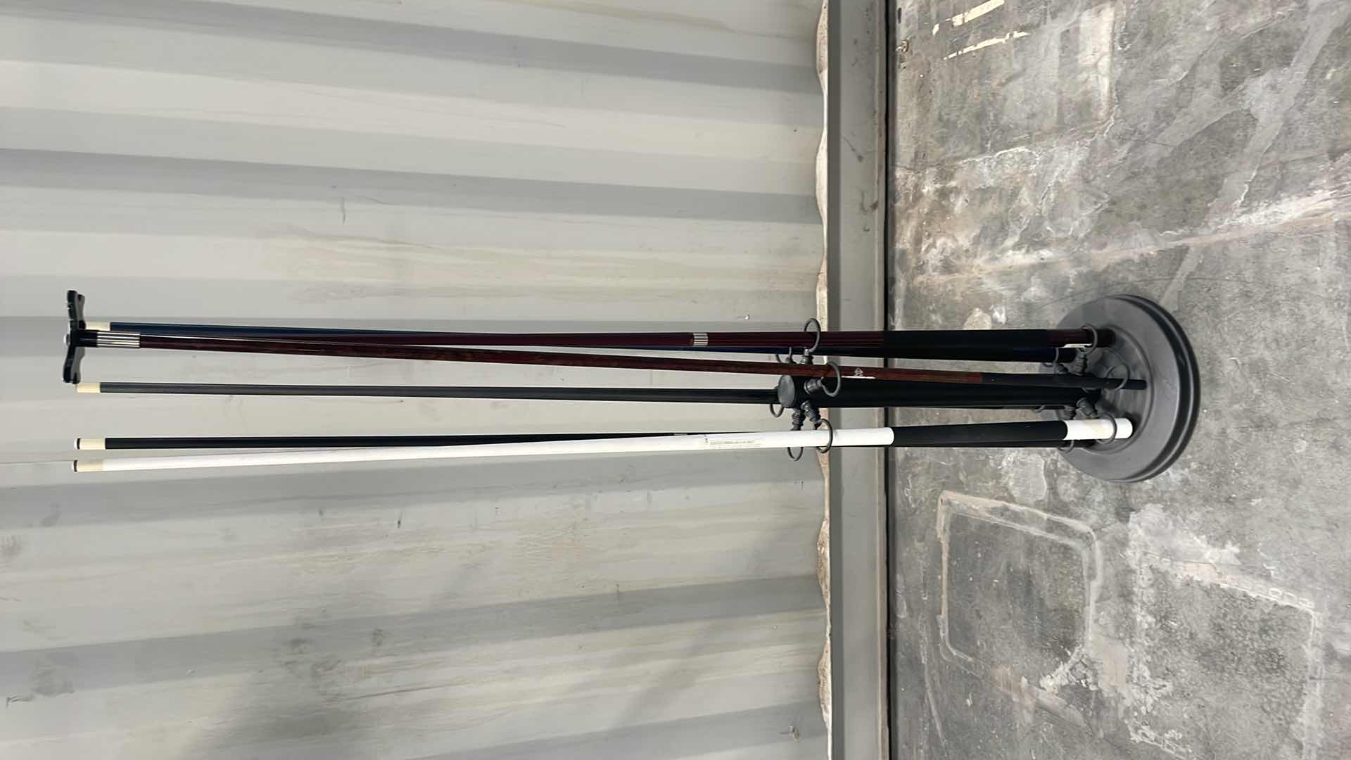 Photo 1 of BILLARD STICKS AND STAND ONE PIECE POOL CUES