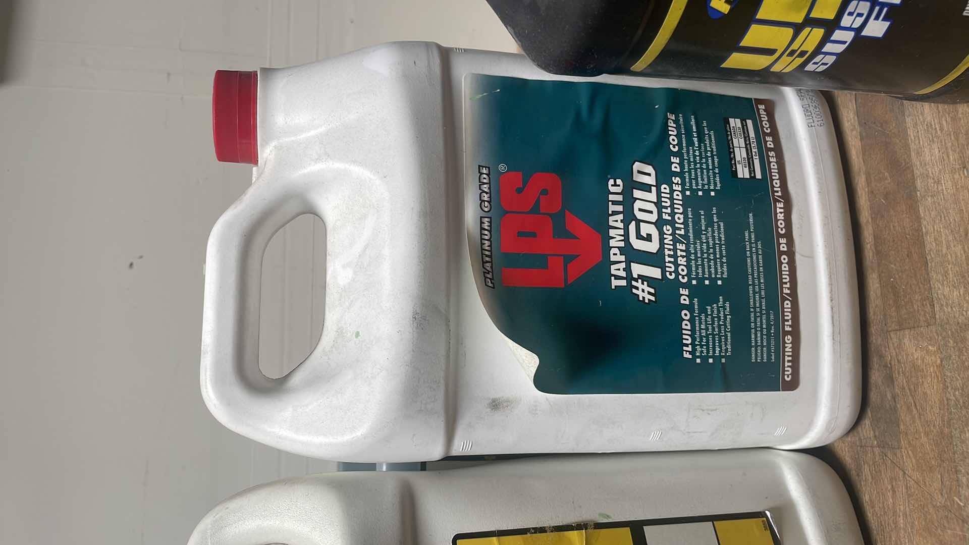 Photo 5 of MISC FLUIDS IN A GRAY PLASTIC CONTAINER SUSPENSION FLUID ABOUT 1/3 FULL