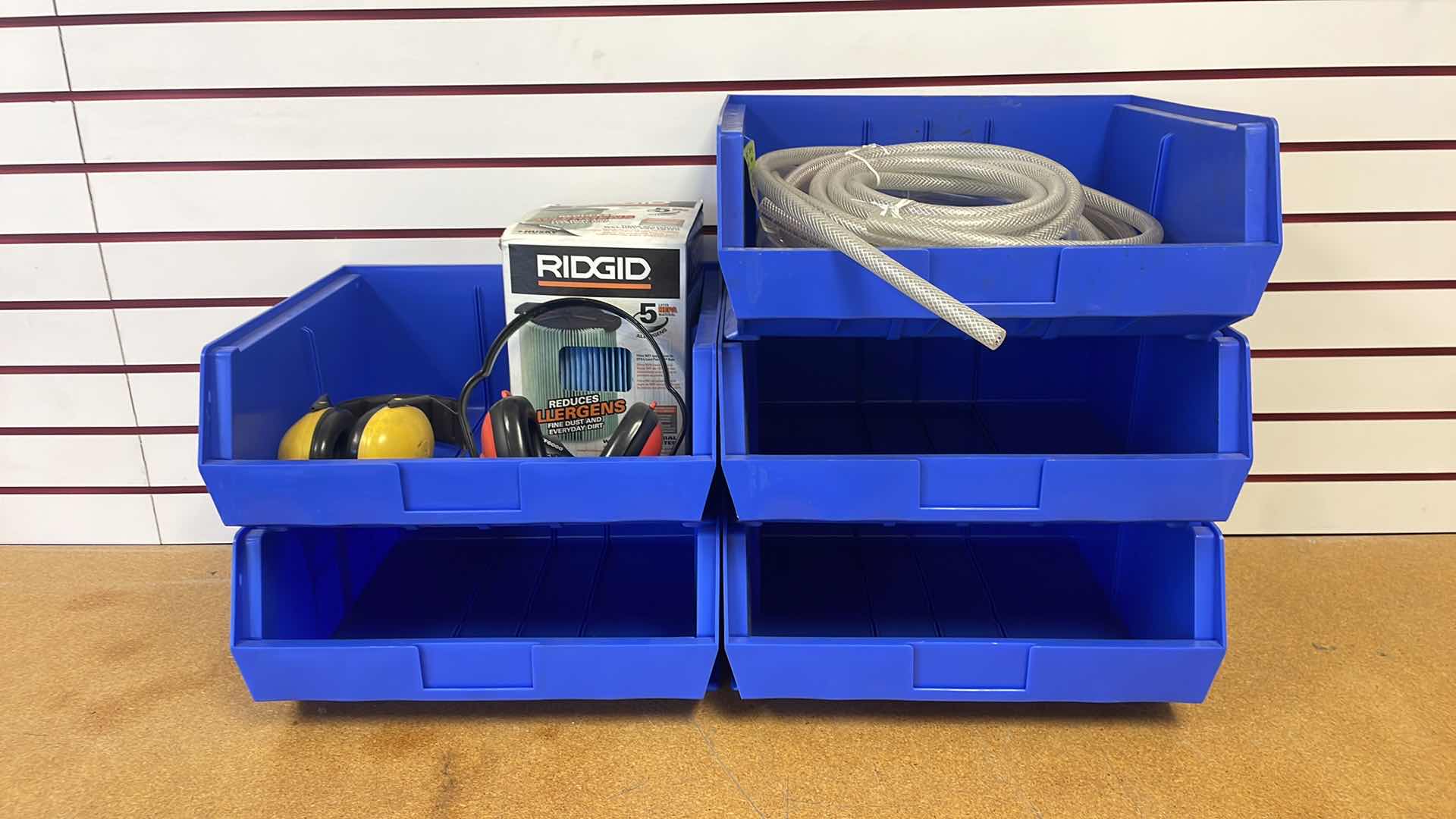 Photo 1 of DURHAM 16-1/2” x 14-1/2” x 7” STACKABLE BINS WITH ASSORTMENT OF HOSES HEARING PROTECTION AND RIDGID WET/DRY VACUUM FILTER