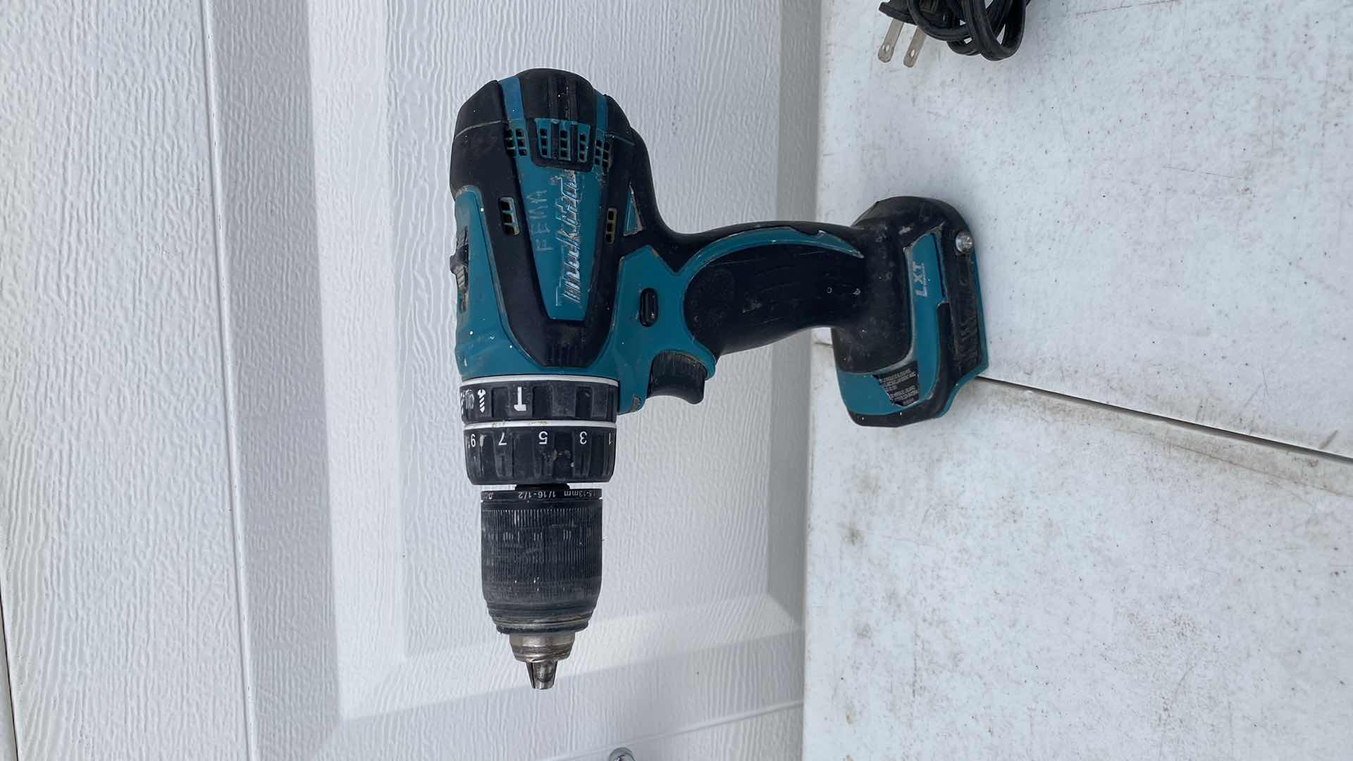 Photo 2 of MAKITA 18V IMPACT AND HAMMER DRILL AND BATTERY CHARGER NO BATTERY 
TESTED WORKING